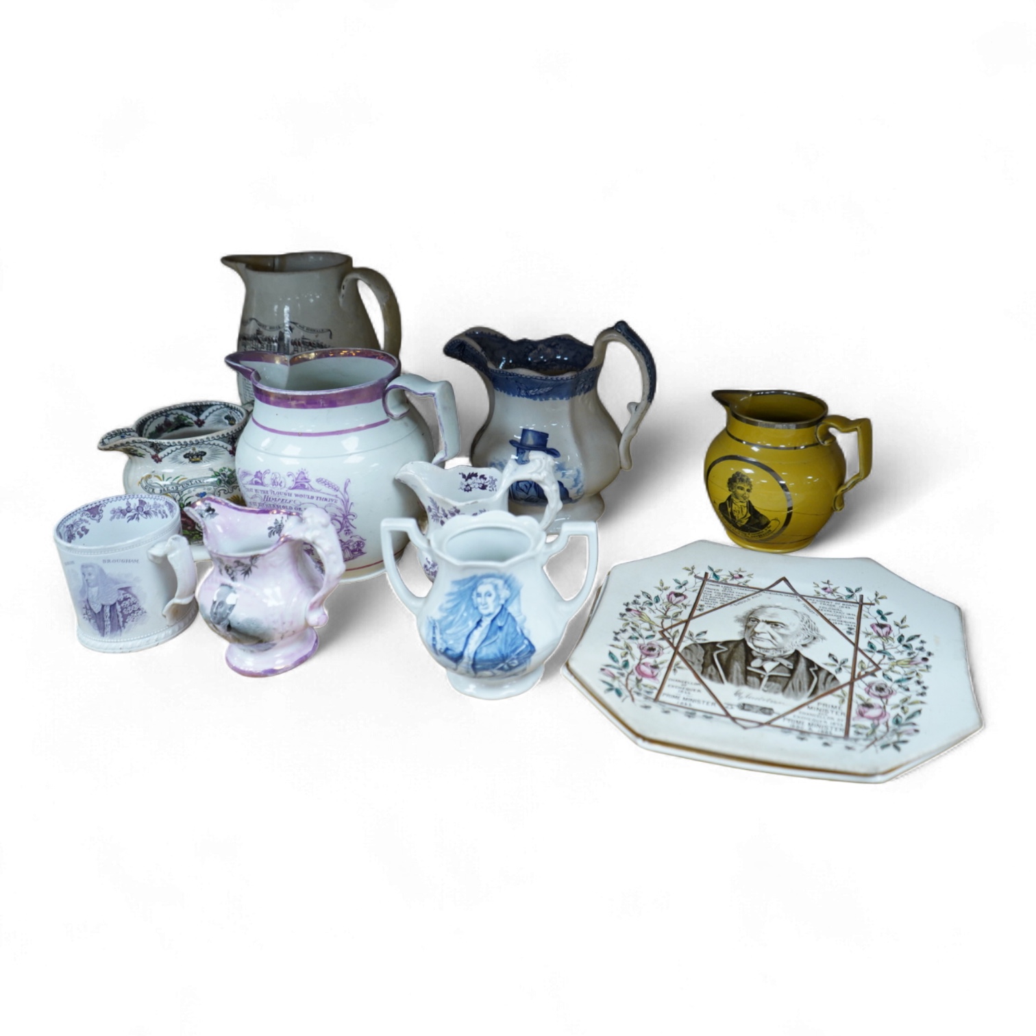 Eleven early to mid 19th century jugs, mugs and plates, all with transfer printed commemorative themes including Gladstone as Prime Minister, Queen Victoria‘s 1887 Jubilee, the Bidston Lighthouse Signals, Lord John Russe